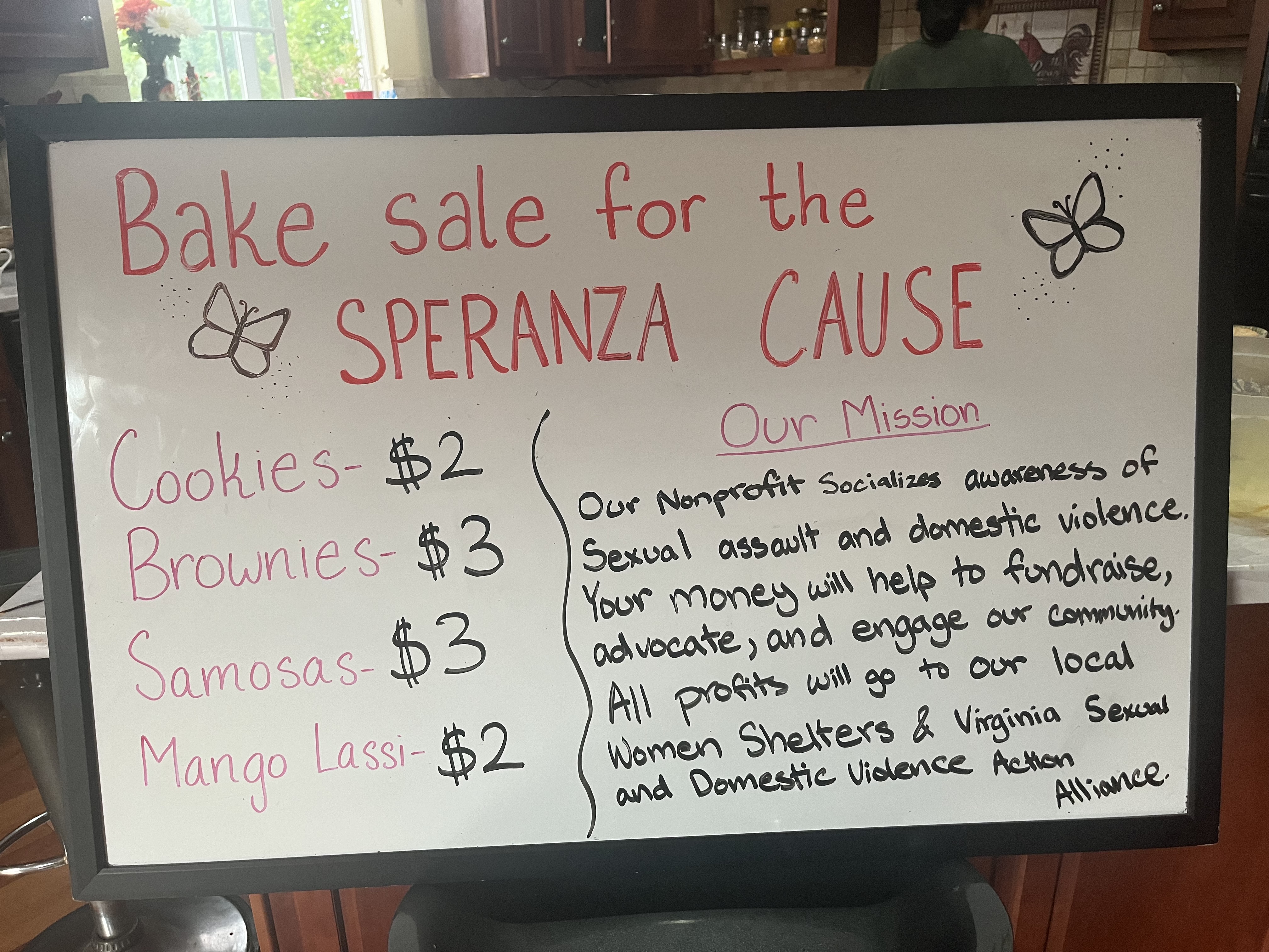A handmade bake sale sign explaining The Speranza Cause mission and fundraiser menu.